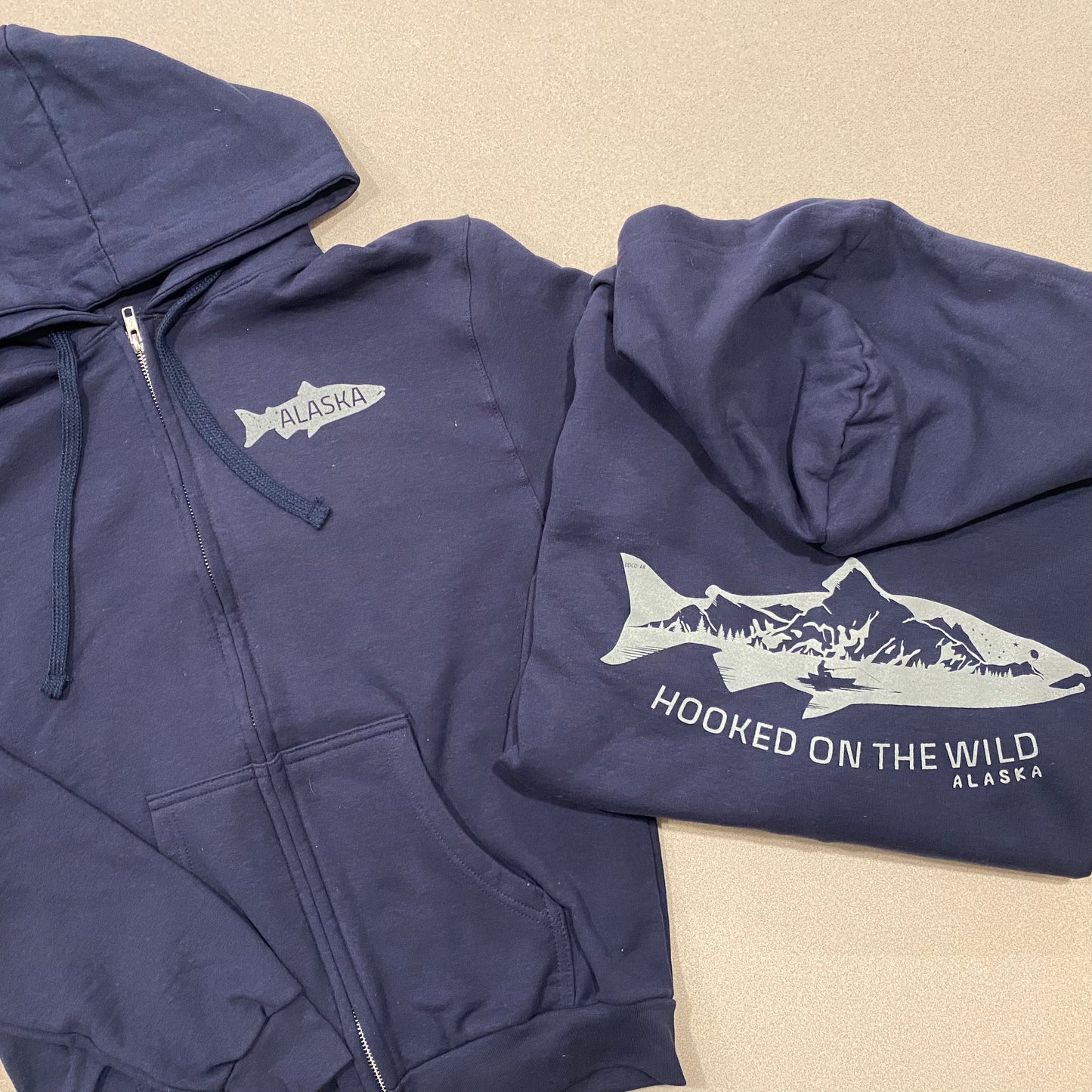 “Hooked on the Wild” Salmon Landscape Zip-Up